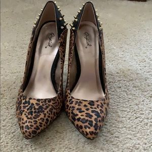 Animal print studded pointy toe heels.